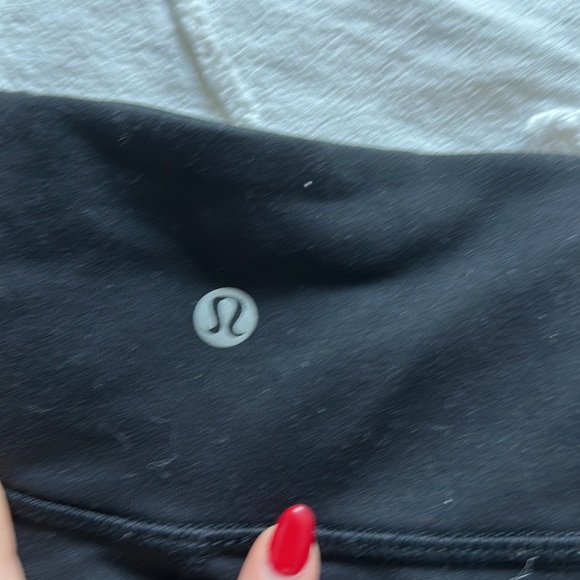Black Lululemon leggings with criss cross on bottom of legs - Picture 3 of 4
